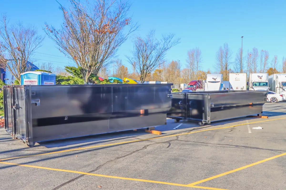 Professional dumpster rental service with roll-off container on residential driveway in Winter Springs